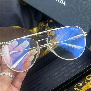 Unisex Prada Gold Frame Sunglasses with iridescent Tint